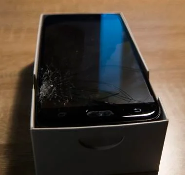 Cell phone with a broken screen Stock Photos