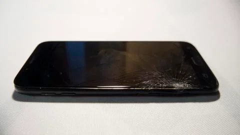 Cell phone with a broken screen Stock Photos