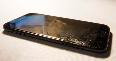 Cell phone with a broken screen Stock Photos