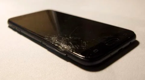 Cell phone with a broken screen Stock Photos