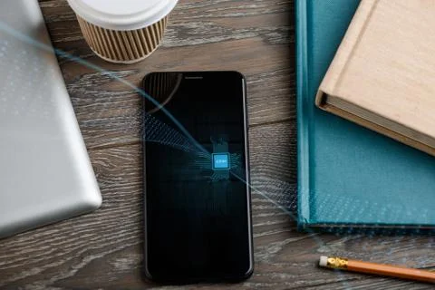 Cell phone with embedded SIM chip and binary code stream Foto stock