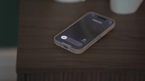 Cell phone ringing on table in the evening by an unknown caller Stock Footage 306696058