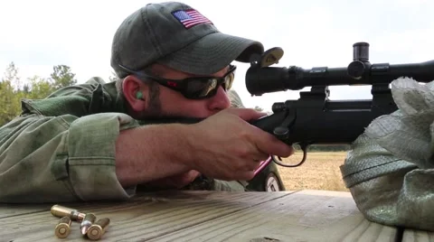 Cell Phone Rings While Man Shoots Sniper Rifle Vidéo 44188881