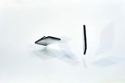 Cell phone with the screen broken by a hammer. Stock Photos