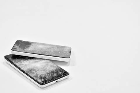 Cell phone with the screen broken. Stock Photos