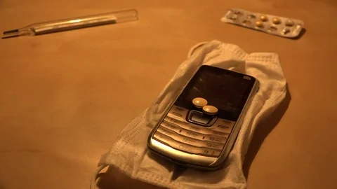 Cell phone on table Video stock 72755643