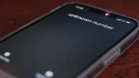 The cell phone on the table is ringing, the payer or bank teller. Unknown call 스톡 동영상 256665015