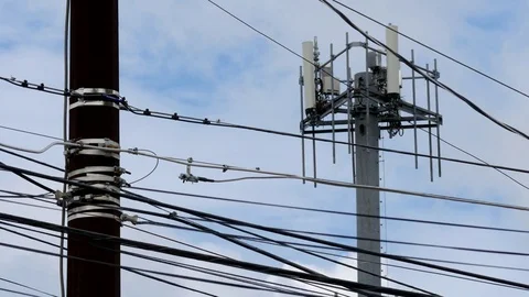 Cell Phone Tower and Power Lines - Timelapse Stock Footage
