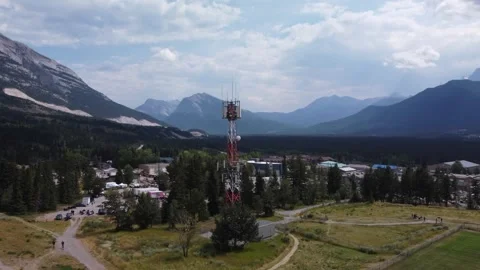 Cell Phone Tower in Mountain Town, approached, aerial, drone 스톡 동영상 344087262