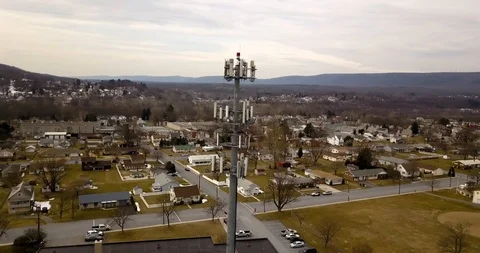 Cell Phone Tower over Small Town 4K Stock Footage 104567871