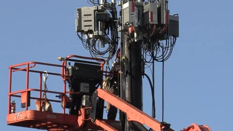 Cell phone tower technician installing 5G equipment in Toronto Stock Footage 142957709