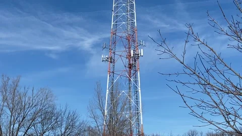 Cell Phone Tower / Telecommunications Tower - Blue Sky Stock Footage 168715213