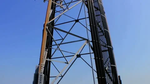 Cell Phone Tower with Tilt Up in Blue Sky Stock Footage