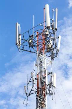 Cell Phone Tower with White Cloud and Blue Sky Stock Photos