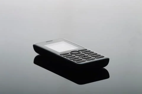 Cell phone on a uniform gradient background Stock Photos