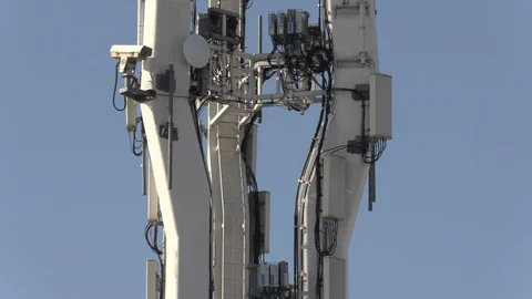 Cell tower with 5G and LTE antennas in city of Toronto Stock Footage 121762746