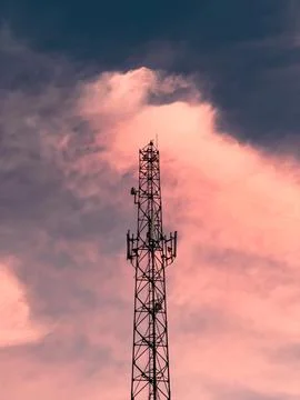 Cell Tower Against Pink Clouds Stock Photos