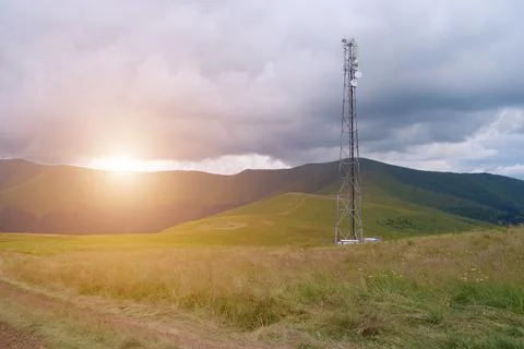 Cell tower and storm clouds in the mountains Stock Photos