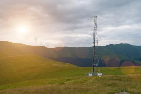 Cell tower and storm clouds in the mountains Photos
