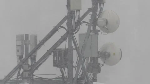 Cell tower antenna in winter cold snow and blizzard conditions Stock-Footage 231730071