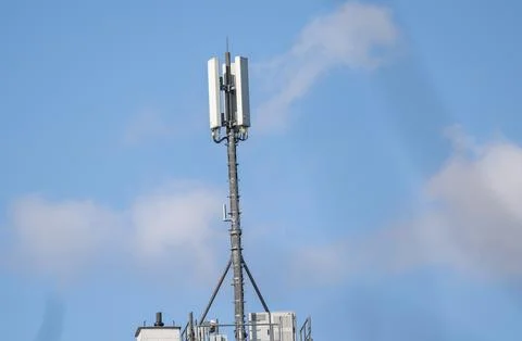Cell tower with antennas providing wireless mobile communication service ag.. Stock Photos