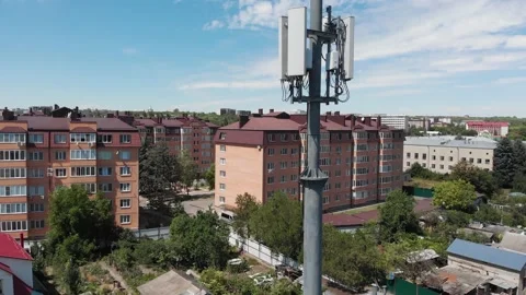 Cell tower on background of multistorey buildings. Stavropol, Russia, 01.09.2020 Stock Footage 144219685