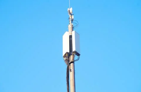Cell tower on a blue sky background Stock Photos