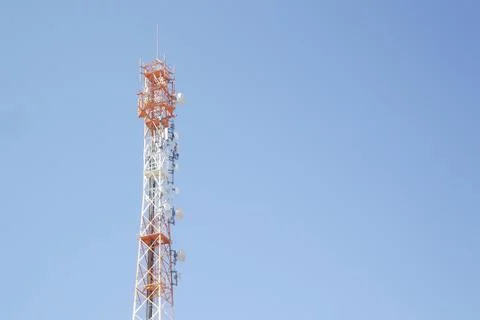 Cell tower in blue sky Stock Photos