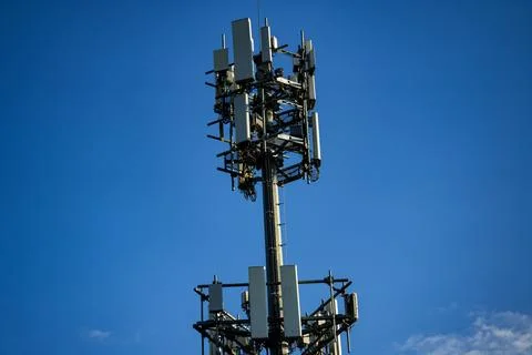 Cell tower. Cellular telecommunications tower. Telecom mobile network. Wireless Stock Photos