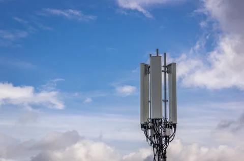 Cell tower with light clouds Stock Photos