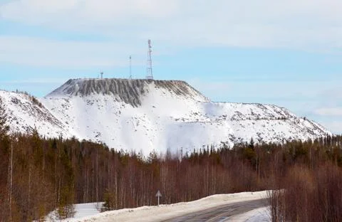 Cell tower on the mountain of artificial origin Stock Photos