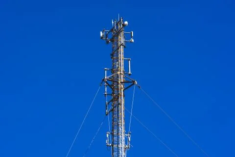 The cell tower operator on the blue sky Stock Photos