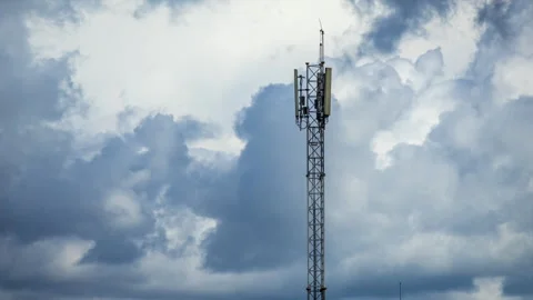 Cell tower standing tall against cloudy sky providing essential mobile network Stock Footage 317442530