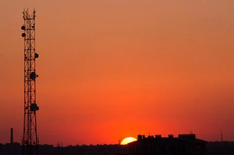 Cell tower at sunset Stock Photos