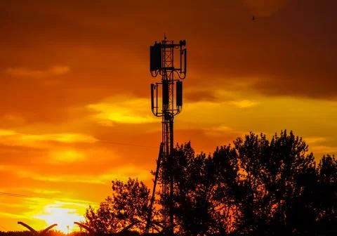 Cell tower at sunset Stock Photos