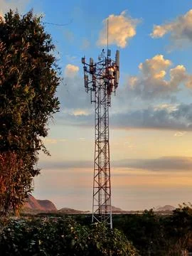 Cell tower at sunset Stock Photos