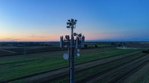 Cell tower transmitting modern telecommunication signals and 5G network con.. Stock Photos