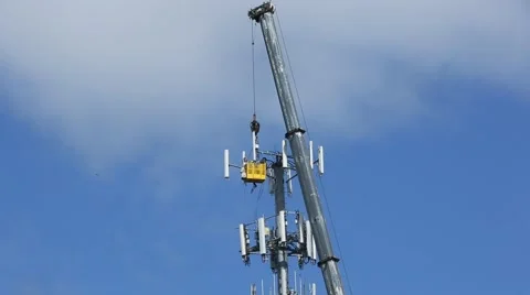 CELL TOWER WORKERS WITH CRANE Stock Footage 50775505