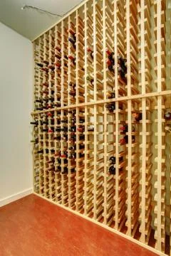 Cellar with large wine holder on wall. Stock Photos