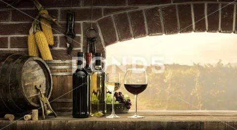 Cellar window and wine bottles Stock Photos