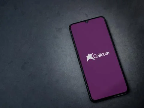 Cellcom app launch screen with logo on the display of a black mobile smartpho Stock Photos