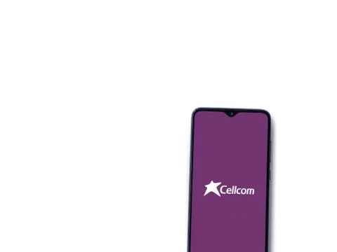 Cellcom app launch screen with logo on the display of a black mobile smartpho Stock Photos