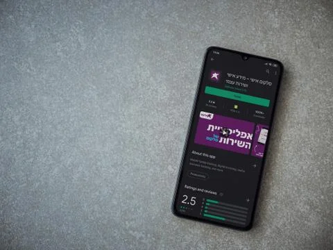 Cellcom app play store page on the display of a black mobile smartphone on ce Stock Photos