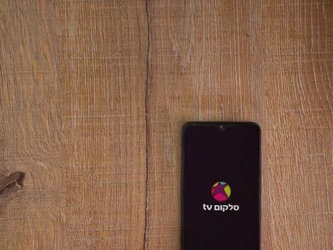 Cellcom TV app launch screen with logo on the display of a black mobile smart Stock Photos