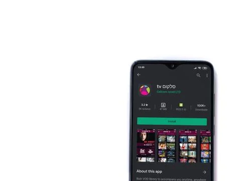 Cellcom TV app play store page on the display of a black mobile smartphone is Stock Photos