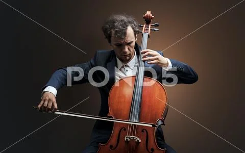 Cellist playing on instrument with empathy Stock Photos