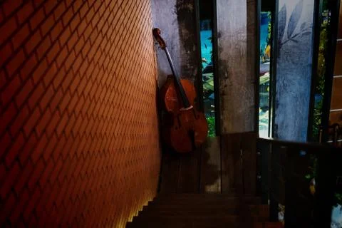 Cello decorated at brick wall Stock Photos