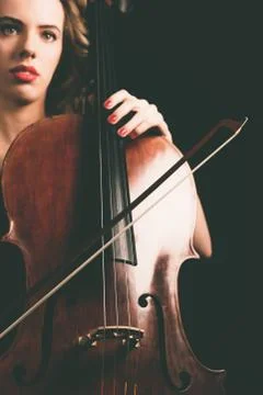 Cello Instrument and Bow Held by a Pretty Lady Stock Photos