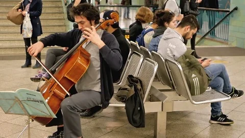 Cello player at metro station Berlin Alexanderplatz Stock-Footage 76448733