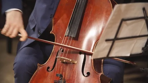 Cello playing close-up Vídeos de archivo 74437726